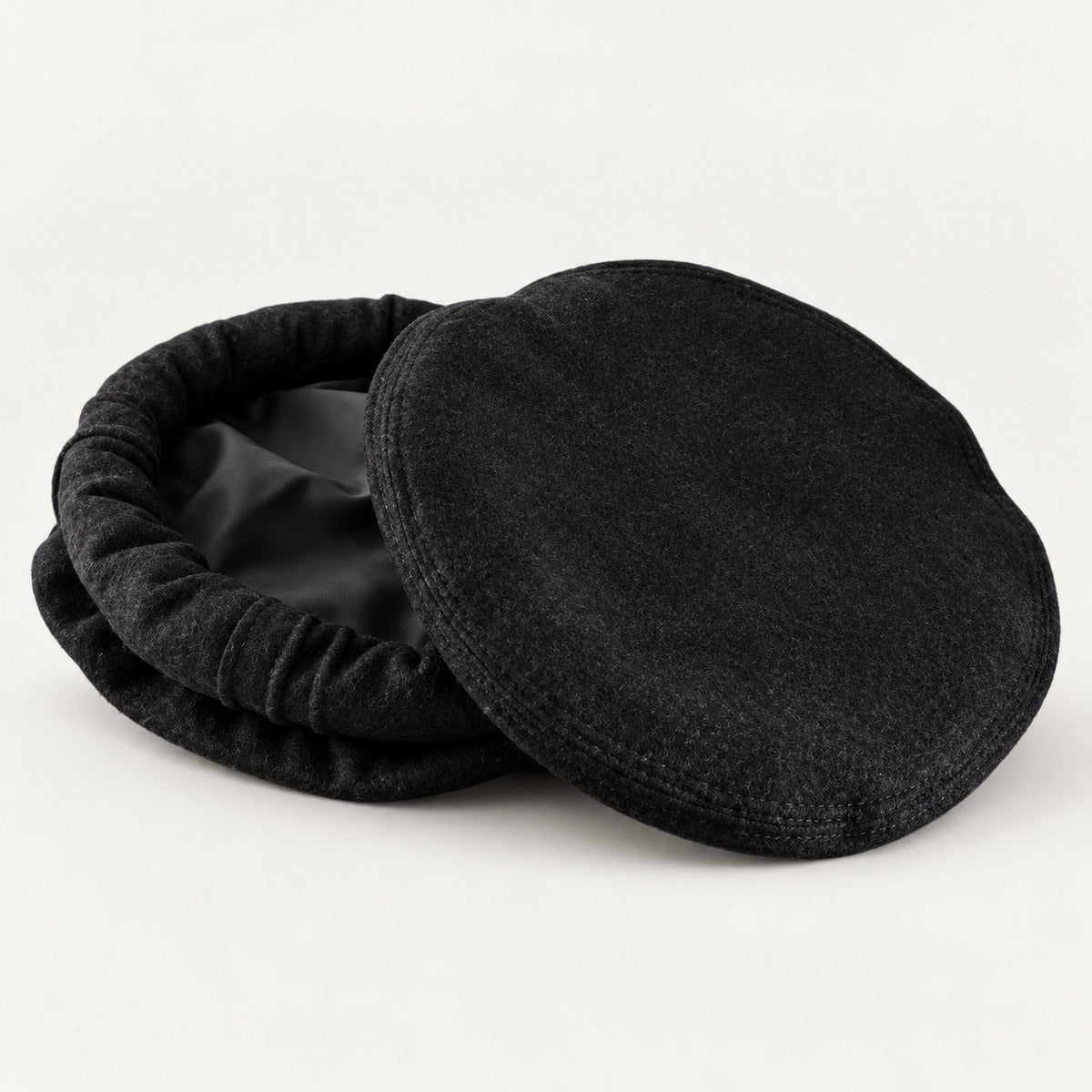 Black wool-style Pakol cap with soft structured rolled edge